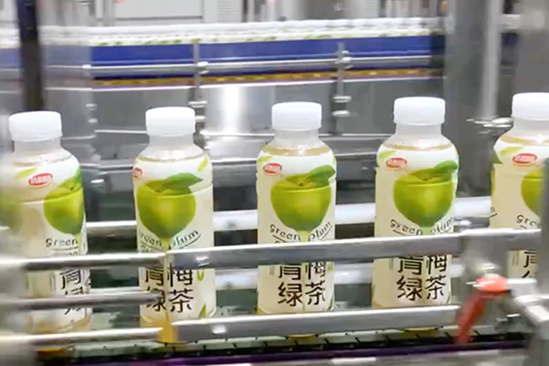 حلول تغليف ليبل شرينك سليف لعبوات الشاي الأخضر البلاستيكية لمجموعة شركات Dali Foods Group